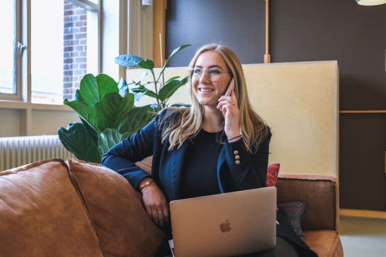Woman getting leads for business with laptop in front of her