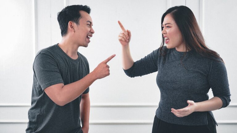 Man and woman arguing in the workplace