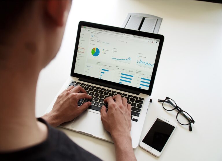 Man on laptop looking at the statistics of an affiliate marketing program