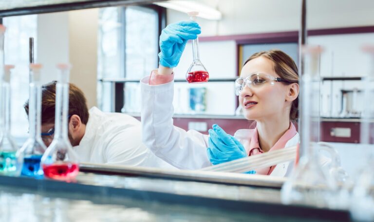 A man and a woman conducting science in a lab.