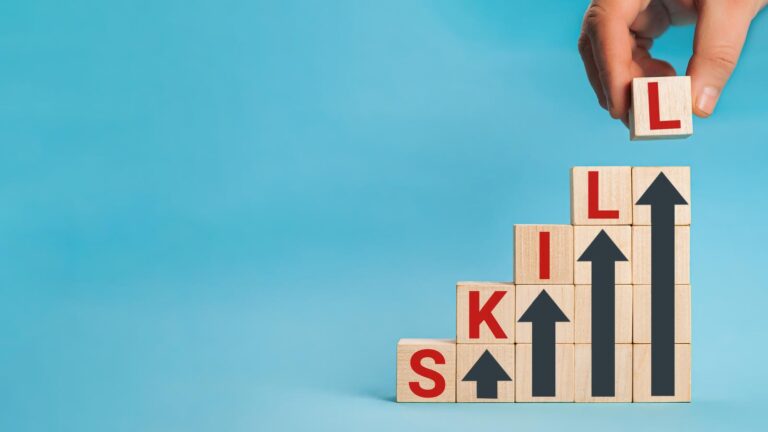The word skill spelt out in blocks with arrows to indicate upskilling