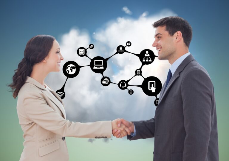 A business man and a business woman shaking hands