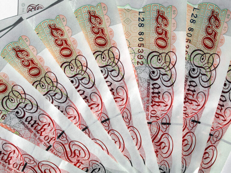 Fifty pound notes arranged in a fan shape