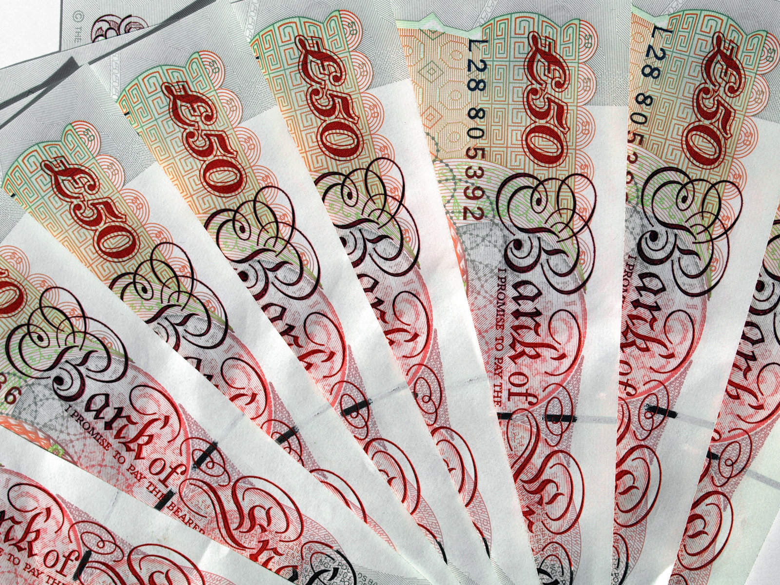 Fifty pound notes arranged in a fan shape